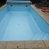 Renovation piscine en béton aux formes complexes par résine armée. Déparetement des Hauts-de-Seine